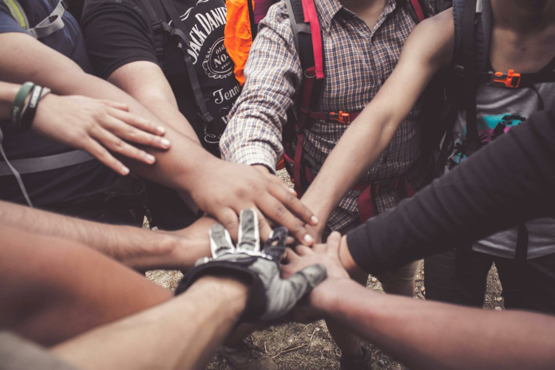 Group of hands joined in teamwork